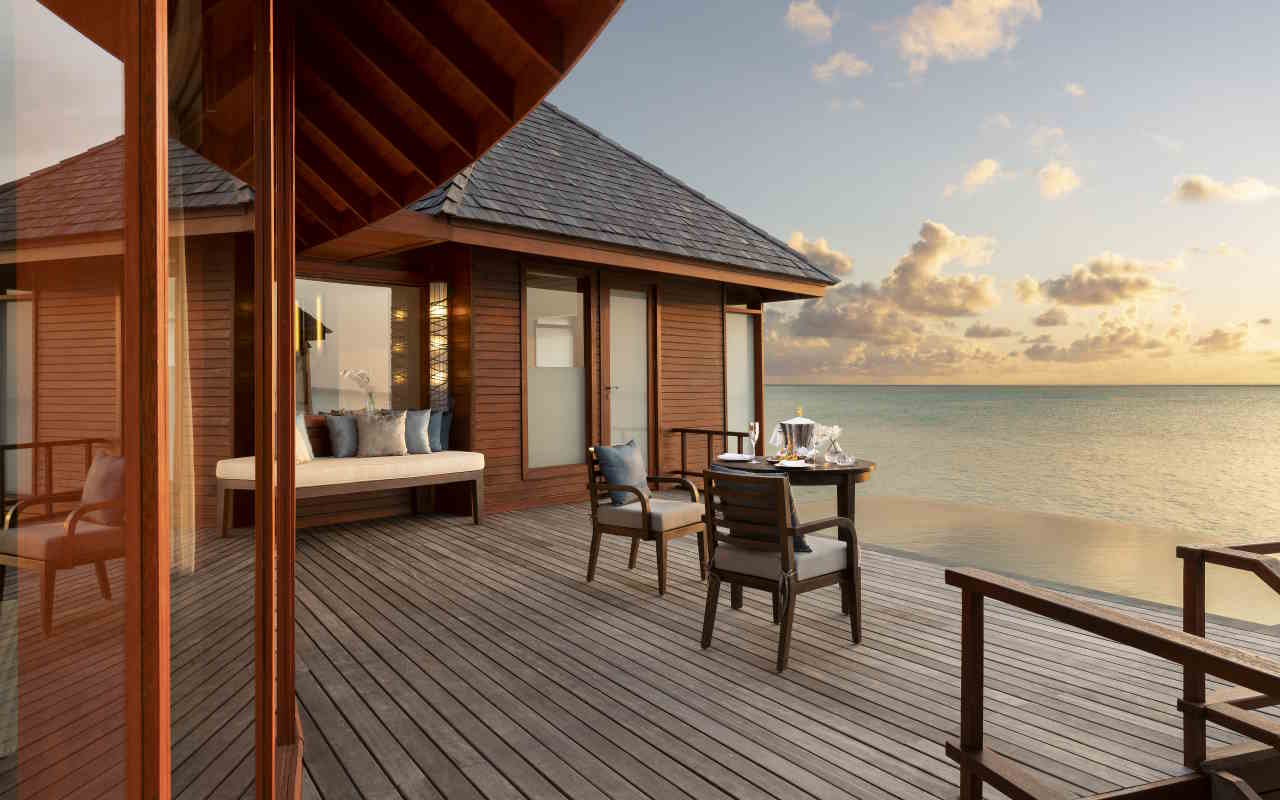 Anantara_Dhigu_Maldives_Resort_Guest_Room_Over_Water_Pool_Suite_Sunset_with_Cocktails